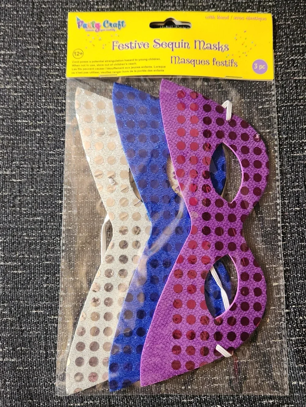 Festive sequin masks in purple, blue, and silver with polka dots